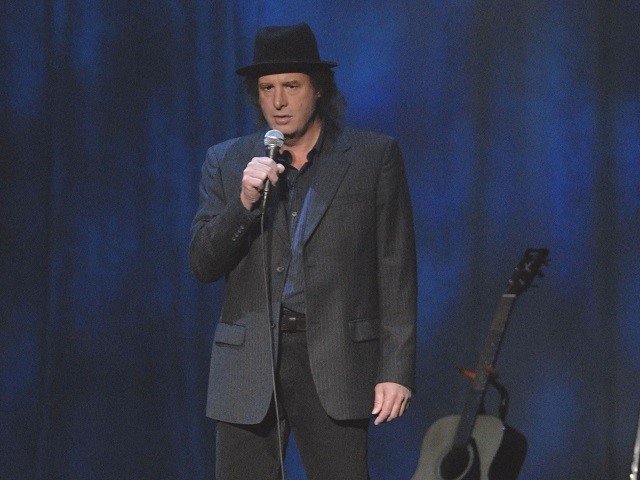 Comedian Steven Wright on stage.